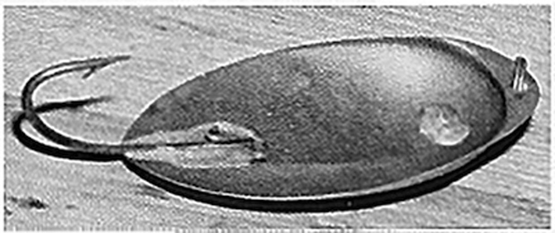 Black-and-white photograph of an early Buel spoon lure with a fixed hook