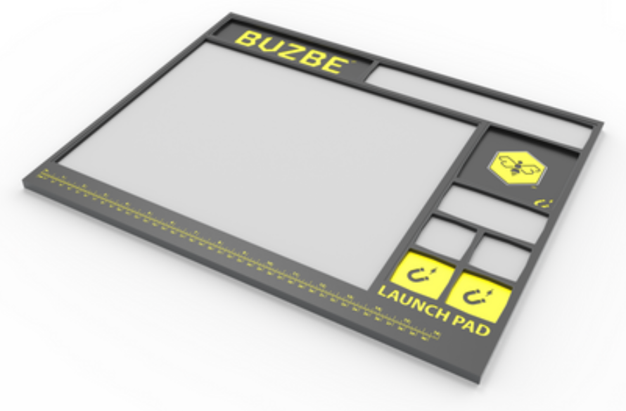 BUZBE Magnetic Launch Pad rigging workstation with magnetic parts trays and built-in ruler